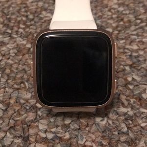 Rose gold Fitbit versa